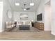 Bright living room features modern furnishings, stylish decor, and plenty of natural light from skylights at 5284 Indian Laurel Ct, Orlando, FL 32808
