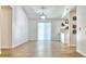 Bright, airy living space with sliding doors and a view of the modern kitchen area at 5284 Indian Laurel Ct, Orlando, FL 32808