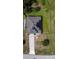 Top-down aerial view of a house, showcasing solar panels, fenced yard, and a driveway at 543 Nardello Dr, Deltona, FL 32725