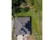 Aerial view of a house featuring solar panels, a fenced yard, and landscaping at 543 Nardello Dr, Deltona, FL 32725