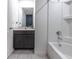 Bathroom featuring a vanity with granite countertop, white bathtub with tile flooring at 543 Nardello Dr, Deltona, FL 32725