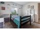 Bedroom featuring bed with turquoise blanket, makeup table, ceiling light and carpeting at 543 Nardello Dr, Deltona, FL 32725