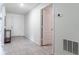 A bright hallway has clean tile flooring and leads to the main entrance at 543 Nardello Dr, Deltona, FL 32725