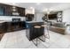 Open kitchen with granite countertops, stainless steel appliances, and an island with seating at 543 Nardello Dr, Deltona, FL 32725