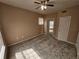 This carpeted bedroom offers a ceiling fan, and a closet with mirrored doors at 5525 Pga Blvd # 4611, Orlando, FL 32839