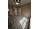 This carpeted bedroom is equipped with a ceiling fan, standard closet, and mirrored closet at 5525 Pga Blvd # 4611, Orlando, FL 32839