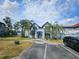 Apartment complex with blue facade, Tudor style accents, and a stairway leading to the second floor entrance at 5525 Pga Blvd # 4611, Orlando, FL 32839