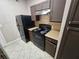 Kitchen with black appliances, practical countertops, and ample cabinet storage for all your cooking essentials at 5525 Pga Blvd # 4611, Orlando, FL 32839