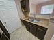 Kitchen featuring a stainless steel double sink and practical countertop space for efficient food preparation at 5525 Pga Blvd # 4611, Orlando, FL 32839