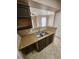 Kitchen sink area featuring a stainless steel double sink and ample countertop space for easy meal preparation at 5525 Pga Blvd # 4611, Orlando, FL 32839
