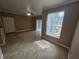 Living area with tile flooring, ceiling fan, and windows providing natural light at 5525 Pga Blvd # 4611, Orlando, FL 32839