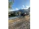 Single-story home featuring a carport, front yard, and neutral-toned exterior with a mix of sun and shade at 628 Cardinal St, Ocoee, FL 34761