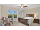 Bright bedroom with a large window offering a view, plus a cozy bed and small desk at 628 Pensacola Ln # 628, Lake Mary, FL 32746