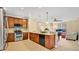 Contemporary kitchen with stainless steel appliances and an open layout that connects to the living area at 628 Pensacola Ln # 628, Lake Mary, FL 32746
