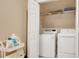 Practical laundry room with modern washer and dryer, plus organized storage at 628 Pensacola Ln # 628, Lake Mary, FL 32746