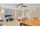 Bright and airy living space featuring ample natural light, home office setup, and adjacent dining area at 628 Pensacola Ln # 628, Lake Mary, FL 32746