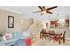Open living area with dining table near kitchen and stairs, plus a comfortable sofa at 628 Pensacola Ln # 628, Lake Mary, FL 32746