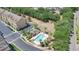 Aerial view of the community pool surrounded by lush landscaping and seating area at 628 Pensacola Ln # 628, Lake Mary, FL 32746