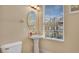 Simple powder room with a pedestal sink, toilet, and window with blinds at 628 Pensacola Ln # 628, Lake Mary, FL 32746