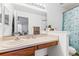 Bathroom featuring a long vanity with sink, mirror, and decorative soap at 725 Cresting Oak Cir # 117, Orlando, FL 32824