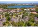 Community aerial view showcasing lush surroundings, serene lake views, and proximity to nearby amenities in a desirable area at 7254 Della Dr, Orlando, FL 32819