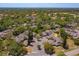 Aerial view showcases community with lush greenery and well-maintained landscaping at 7254 Della Dr, Orlando, FL 32819