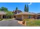 Inviting exterior showcasing a well-maintained, two-story home with a two-car garage and tastefully landscaped front yard at 7254 Della Dr, Orlando, FL 32819