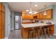 Well-equipped kitchen with wooden cabinets, stainless steel appliances, tiled backsplash, and a convenient center island at 7254 Della Dr, Orlando, FL 32819
