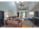 Bright living room featuring soaring ceilings, comfortable seating, and a welcoming atmosphere with lots of natural light at 7254 Della Dr, Orlando, FL 32819