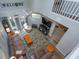 Upper view of a spacious living room with high ceilings, comfortable seating, and wood floors, creating a cozy atmosphere at 7254 Della Dr, Orlando, FL 32819