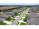 Aerial view of a residential neighborhood featuring well-maintained houses and tree-lined streets at 9040 Alba Ln, Kissimmee, FL 34747
