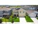 Two-story home in a residential area with solar panels, well-maintained lawns, and mature landscaping at 9040 Alba Ln, Kissimmee, FL 34747