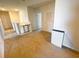 Upstairs hallway featuring carpet flooring, white walls, and a safety gate at 9040 Alba Ln, Kissimmee, FL 34747
