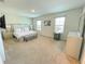Spacious main bedroom with carpet, a neutral color palette, and ample natural light from two windows at 9040 Alba Ln, Kissimmee, FL 34747