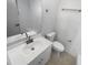 Bathroom featuring modern vanity, a large mirror, and a toilet with sleek finishes at 9345 Buttonwood St, Orlando, FL 32825