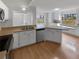 Well-appointed kitchen with sleek appliances, a large counter, and abundant natural light from multiple windows at 9345 Buttonwood St, Orlando, FL 32825