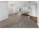Spacious living room with a combination of carpet and hardwood floors, offering ample space for seating and relaxation at 9345 Buttonwood St, Orlando, FL 32825