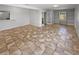 Large living room featuring tile flooring and a view of the yard, creating a bright and airy atmosphere at 9345 Buttonwood St, Orlando, FL 32825