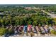 An aerial view showing this house with a private pool within a community of homes at 9911 Dean Cove Ln, Orlando, FL 32825