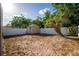 Spacious backyard featuring a storage shed and partial fencing, perfect for outdoor activities at 9911 Dean Cove Ln, Orlando, FL 32825