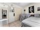 Bedroom with tile floors, ample closet space, and adjacent space with view into another room at 9911 Dean Cove Ln, Orlando, FL 32825