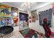 Bedroom with ceiling fan, tile floors, and fun decor at 9911 Dean Cove Ln, Orlando, FL 32825