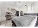 Bedroom with white tile flooring, ceiling fan and organized shoe racks and decorative wall art at 9911 Dean Cove Ln, Orlando, FL 32825