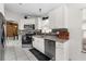 Well-lit kitchen with granite countertops, stainless steel appliances, and tiled backsplash at 9911 Dean Cove Ln, Orlando, FL 32825