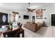 Bright living room with tile floors, a modern ceiling fan, and an open layout at 9911 Dean Cove Ln, Orlando, FL 32825