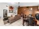 Open-concept living room with tile flooring, ceiling fan, and neutral decor at 9911 Dean Cove Ln, Orlando, FL 32825