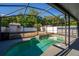 Gorgeous pool with waterfall feature and screened enclosure at 9911 Dean Cove Ln, Orlando, FL 32825