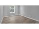 Bright bedroom with neutral walls, trim and luxury vinyl plank flooring at 12928 Lexington Summit St, Orlando, FL 32828