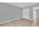 Spacious bedroom features luxury vinyl plank flooring, ample closet space and neutral color palette at 12928 Lexington Summit St, Orlando, FL 32828