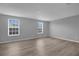 Bright bedroom with hardwood floors and light gray walls at 12928 Lexington Summit St, Orlando, FL 32828